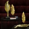 ELIOT gold leaf-shaped figurine, glamour style, beautiful
