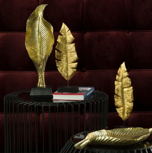 ELIOT gold leaf-shaped figurine, glamour style, beautiful