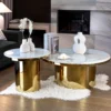 SET OF TWO TABLES round sintered stone tops, gold bases with high gloss finish