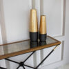 console-industrial-style-black-legs-gold-elements-composition