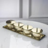 set-of-four-containers-on-a-straight-sided-gold-tray-gold-metal-lids-with-handles-glass-containers-classic-style