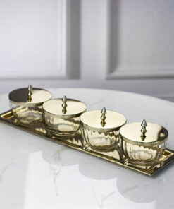 set-of-four-containers-on-a-straight-sided-gold-tray-gold-metal-lids-with-handles-glass-containers-classic-style