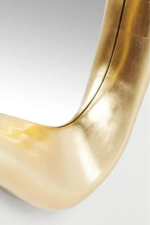 WALL LIRROR of irregular shape, gold frame, glamour style, decorative