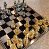 Chess pieces in elegant style, gold and black pawns, decorative, unique