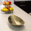 PATTERN of gold in the shape of a large leaf, beautiful texture, glamorous style, beautiful