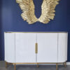 white chest of drawers, fluted with gold metal details, sintered stone top, glamorous, beautiful