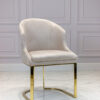 Upholstered chair, velour fabric, golden legs, glamour style, cream-colored