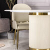 Round dining table, light beige, fluted base, gold metal details, unique