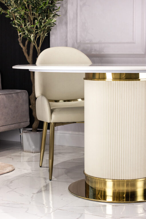 Round dining table, light beige, fluted base, gold metal details, unique