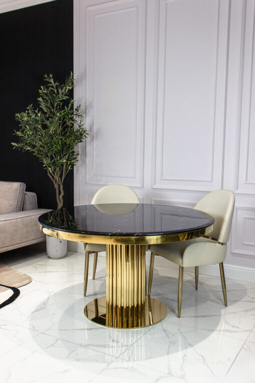 Round dining table on gold designer base, black imitation marble top, glamour, for living room