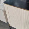 Cashmere dresser, gold metal details, fluted body, black top, modern, beautiful