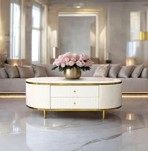 Anne coffee table with fluted white body, gold metal accessories, sintered top