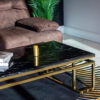 Rectangular coffee table on gold glossy frame, black imitation marble top, modern style