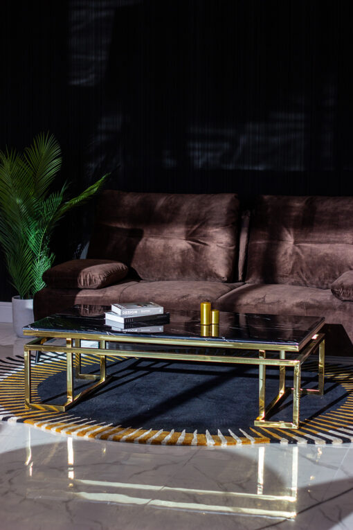 Rectangular coffee table on gold shiny frame, black imitation marble top, modern style, beautiful