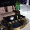 Rectangular coffee table on gold shiny frame, black imitation marble top, modern style, beautiful