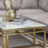 Rectangular coffee table on gold shiny frame, white top imitating marble, modern style, exquisite