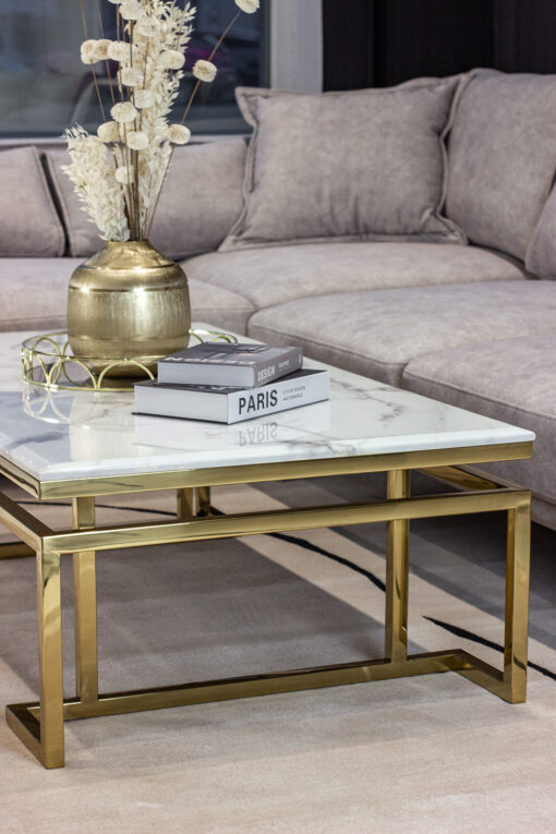 Rectangular coffee table on gold shiny frame, white top imitating marble, modern style, exquisite