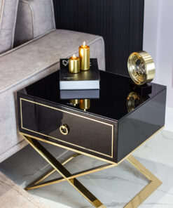 Nightstand with black body on gold metal legs in modern style, for living room