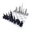 Stainless steel chess pieces in the shape of famous buildings, marble chessboard, exclusive, beautiful