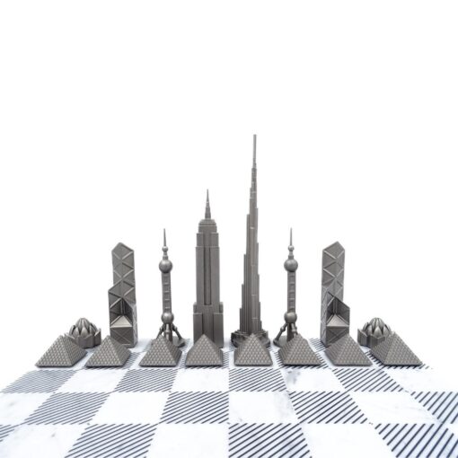 Stainless steel chess pieces in the shape of famous buildings, marble chessboard, exclusive, sophisticated